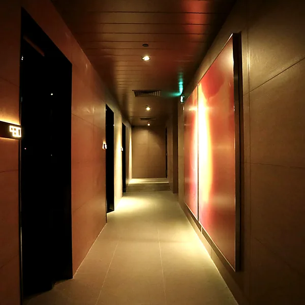 Quiet room corridor with warm light and darker walls for a classic club atmosphere photo